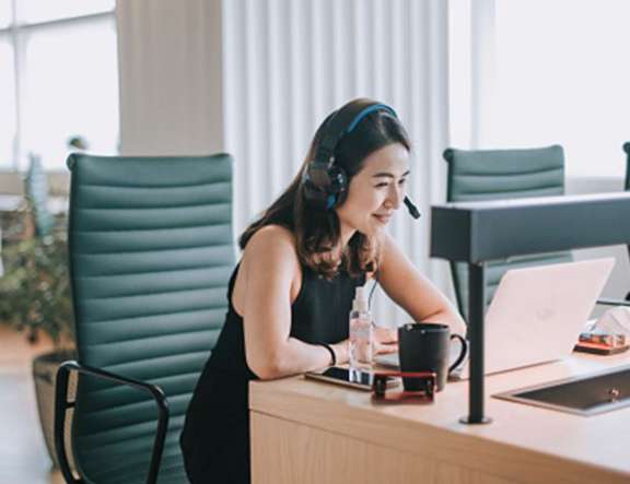 Woman with headset in office